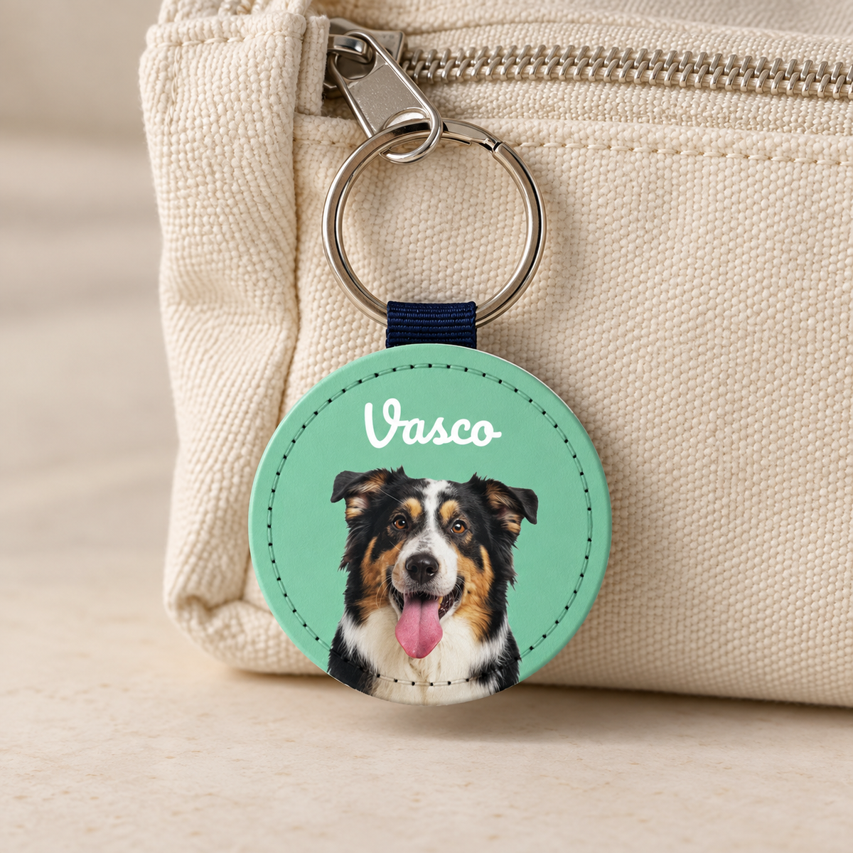 Personalized keychain with a dog pet portrait, green and black colours, extra name "Vasco".