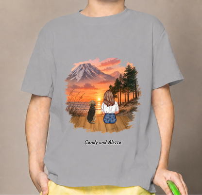 Grey kids' T-shirt with a graphic of a sitting person and a dog at sunset.