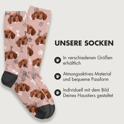 Personalized socks with dog designs on a pink background and black cuff. Breathable material.