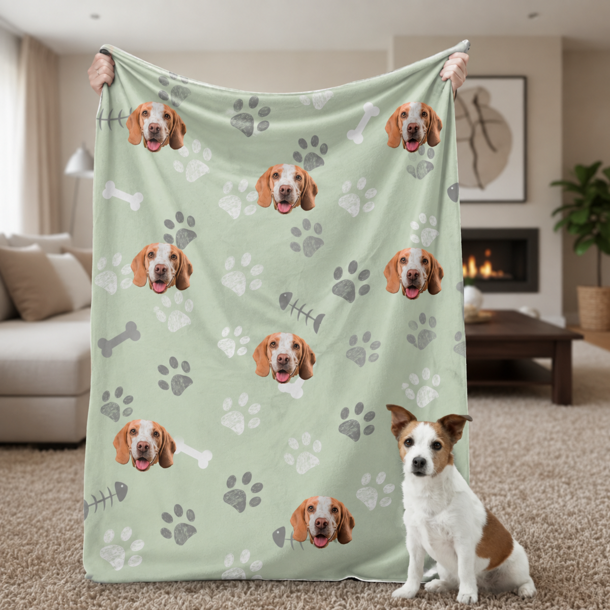 Personalized green pet blanket with dog motifs, held by a person in the living room.